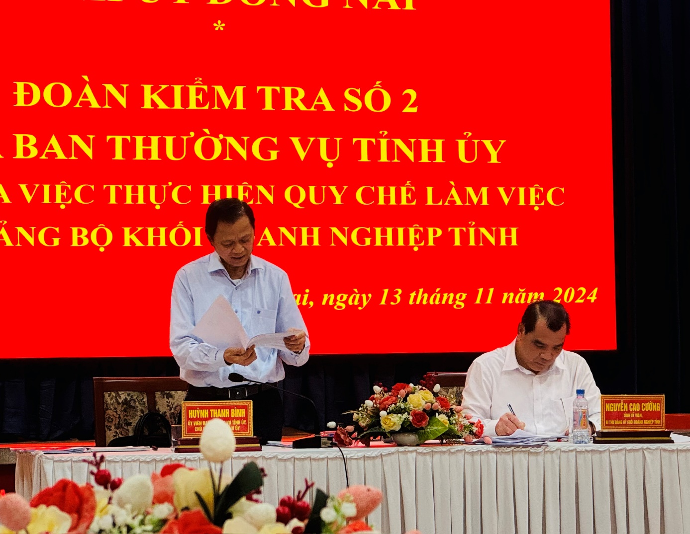 A group of men at a tableDescription automatically generated