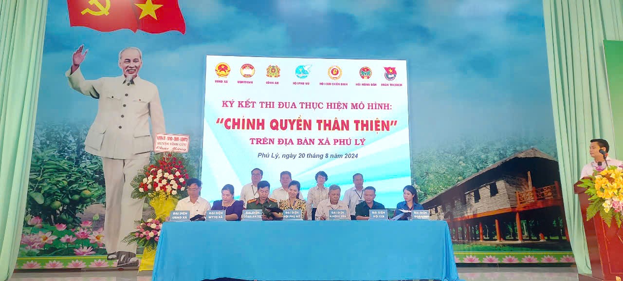 A group of people sitting at a tableDescription automatically generated