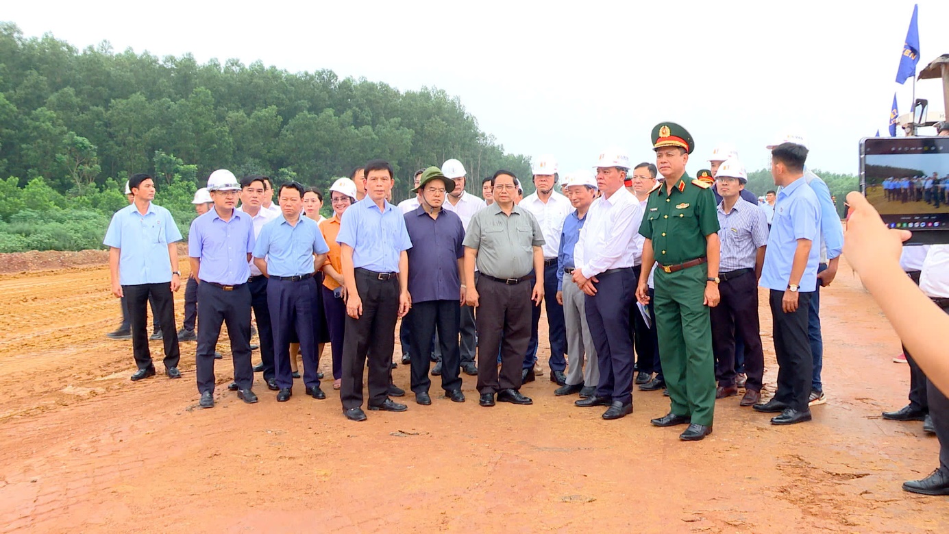 A group of men standing in a lineDescription automatically generated