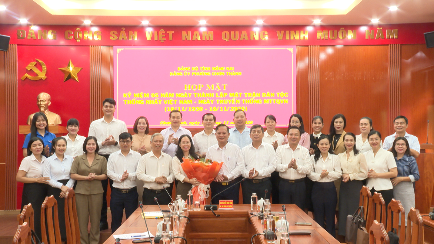 A group of people standing in front of a pink signAI-generated content may be incorrect.