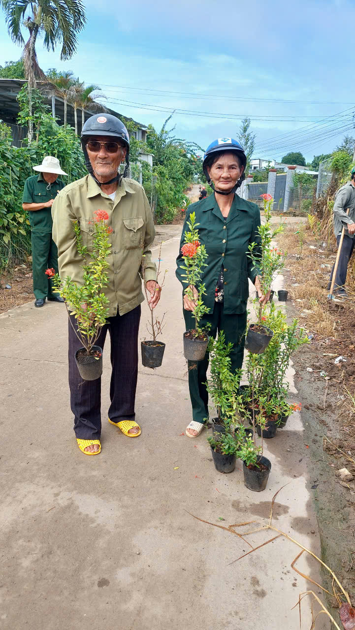 A person and person holding plantsDescription automatically generated